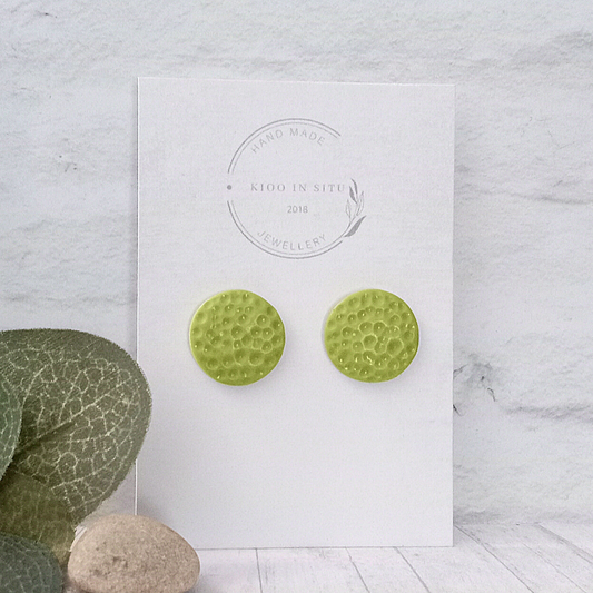 Show off your unique style with these one-of-a-kind handmade lime green ear studs! Crafted from polymer clay, these 15mm earrings offer an eye-catching look.